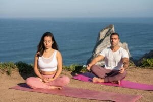 A serene yoga session overlooking the ocean in Portugal, perfect for relaxation and meditation.