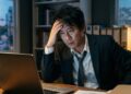 Professional pausing after work while beginning a burnout recovery plan.